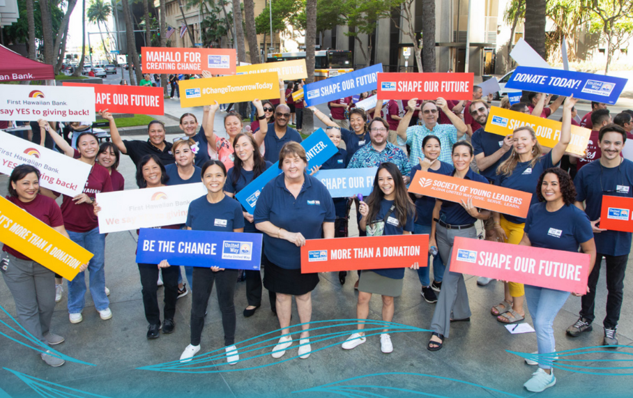 People holding signs to support AUW