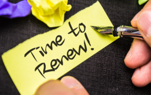 Paper says "Time to Renew!" with Pen